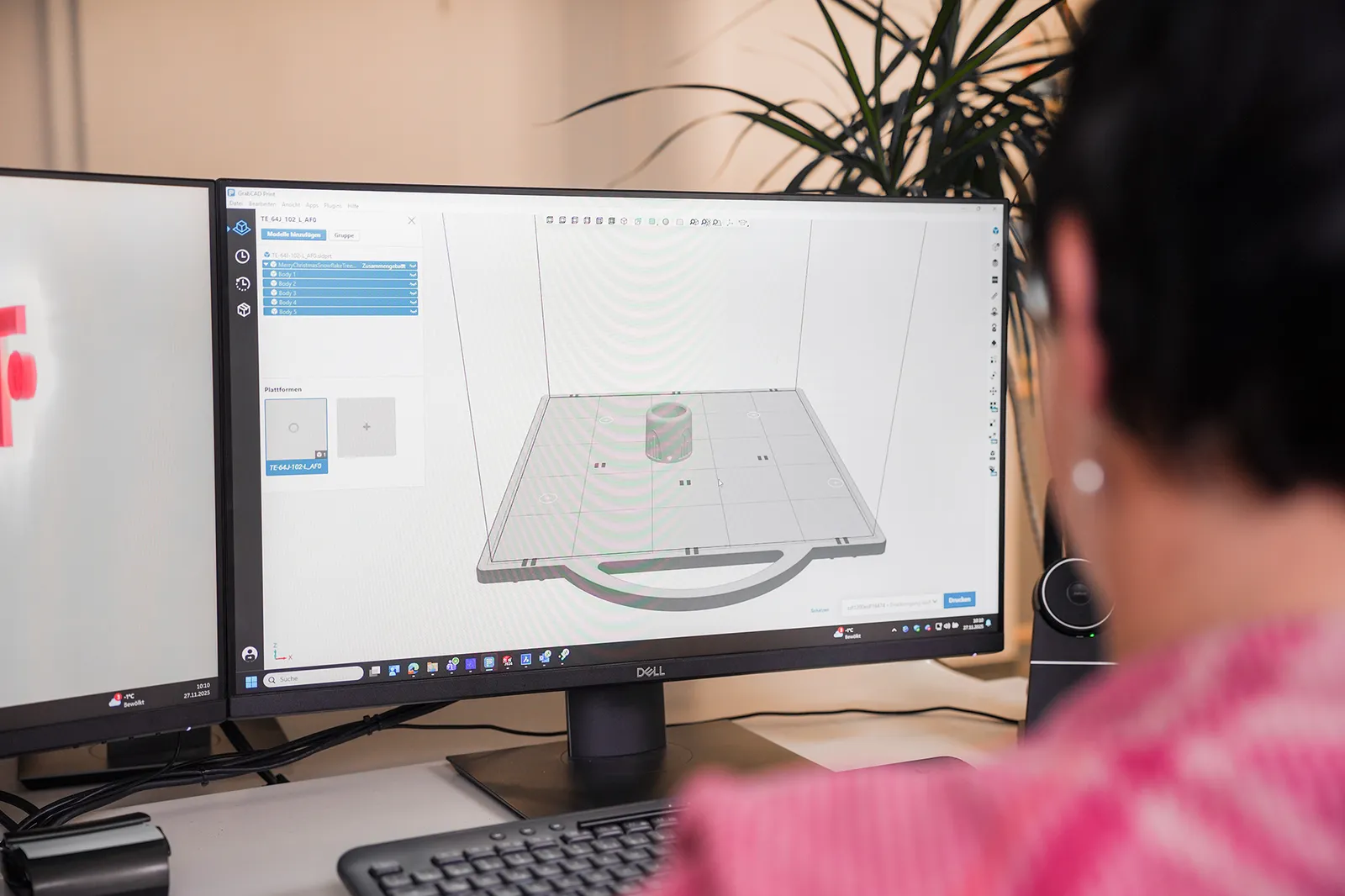 Employee working on a PC creating a CAD drawing